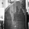 The Rosetta Stone, a granite stone with an ancient Egyptian text inscribed.