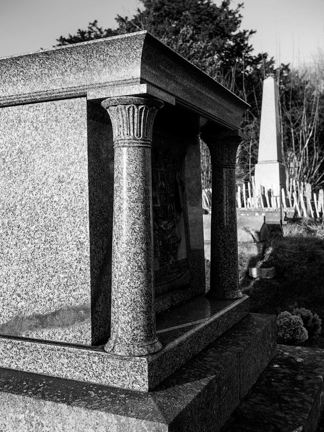 A closeup of one end of Beckford's grave. You can see two of the Egyptianesque pillars in detail. In the background is an obelisk-shaped grave.