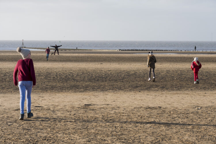 children running on the beach