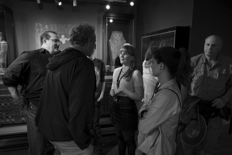 a group of people in a museum gallery