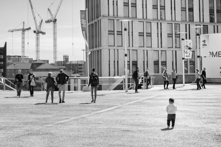 a toddler amongst shoppers at liverpool one